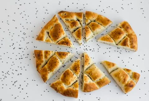 Turkish Ramadan Bread sliced triangle shape on white surface 写真素材