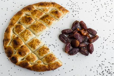 Turkish Ramadan Bread,pide and dates in the form of crescent and star Stock Photos