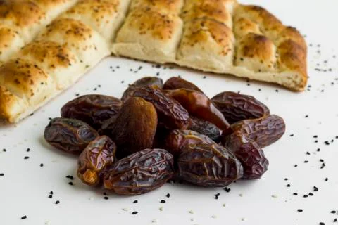 Turkish Ramadan Bread,pide and dates in the form of crescent and star Stock Photos