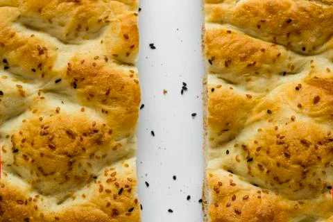 Turkish Ramadan Bread,Pide cut in half on white Stock Photos