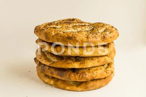 Turkish Ramadan Bread,Pide with sesame seeds stacked on white ~ Premium ...