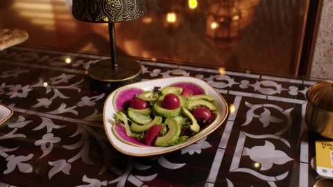 Turkish restaurant serving a traditional avocado and tomato salad on a Stock Footage 345134027