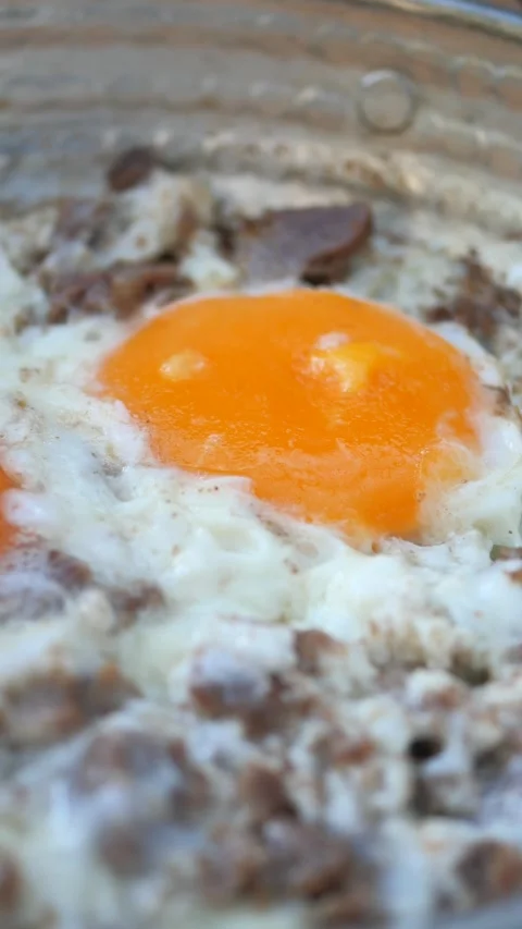 Turkish scrambled eggs with roasted meat in copper pan Video stock 259365429