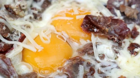Turkish scrambled eggs with roasted meat in copper pan Video stock 268535460