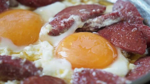 Turkish scrambled eggs with roasted susage in copper pan Video stock 252243980