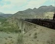 Turkish steam train going over bridge SD Footage