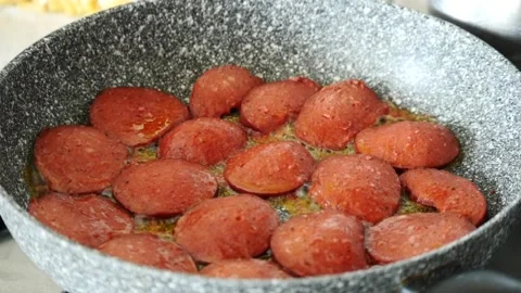 Turkish style pan fried beef sausage with large slices, hot beef sausage is c 動画素材 199133268