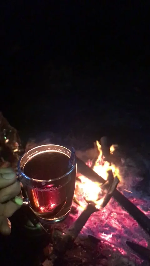 Turkish Tea by a Glowing Campfire at Night Stock Footage 342182266