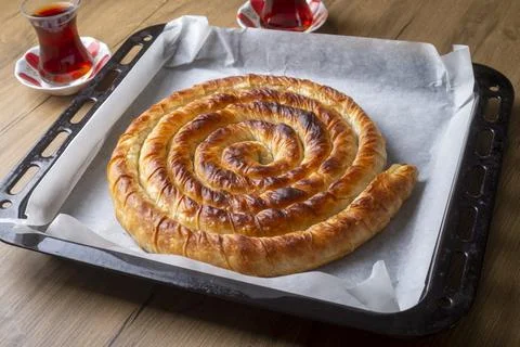 Turkish Tepsi Boregi, Round Borek, Tray pastry (Turkish name; rulo borek) Stock Photos