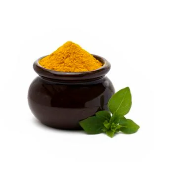Turmeric in a brown pot Stock Photos