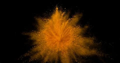 Turmeric, curcuma longa, Powder Exploding against Black Background, Indian .. Stock Photos