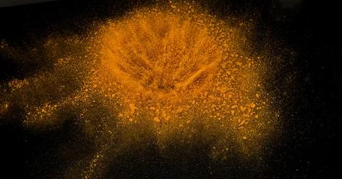 Turmeric, curcuma longa, Powder Exploding against Black Background, Indian .. 스톡 사진