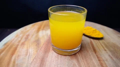 Turmeric Drink on Table Stock Footage 299190755