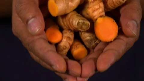 Turmeric In Hand Video stock 122764086