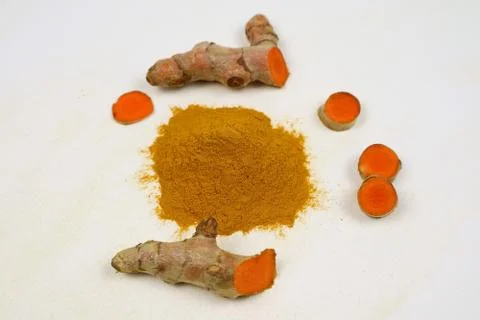Turmeric powder and turmeric roots are isolated on a white background Stock Photos