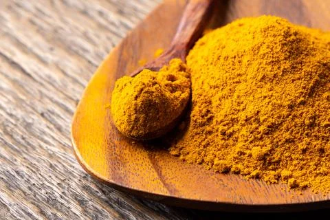 The turmeric powder is a natural herb and is an ingredient for food cooking.. Stock Photos