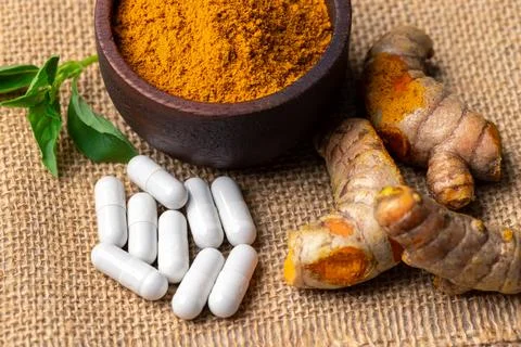 The turmeric powder is a natural herb and is an ingredient for food cooking.. Stock Photos