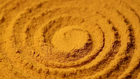Turmeric powder spirally twisted, close-up image Stock Footage 134207843