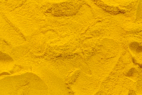 Turmeric powder texture background pattern Stock Photos
