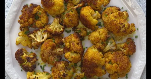 Turmeric Roasted Cauliflower on a serving plate. Stock Footage 308784221
