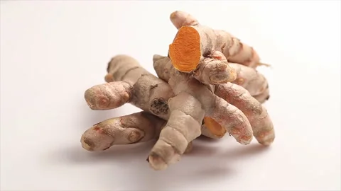 Turmeric roots isolated on white background Rotation Stock Footage 222783904