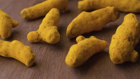 Turmeric roots on the wooden table Stock Footage 140010990