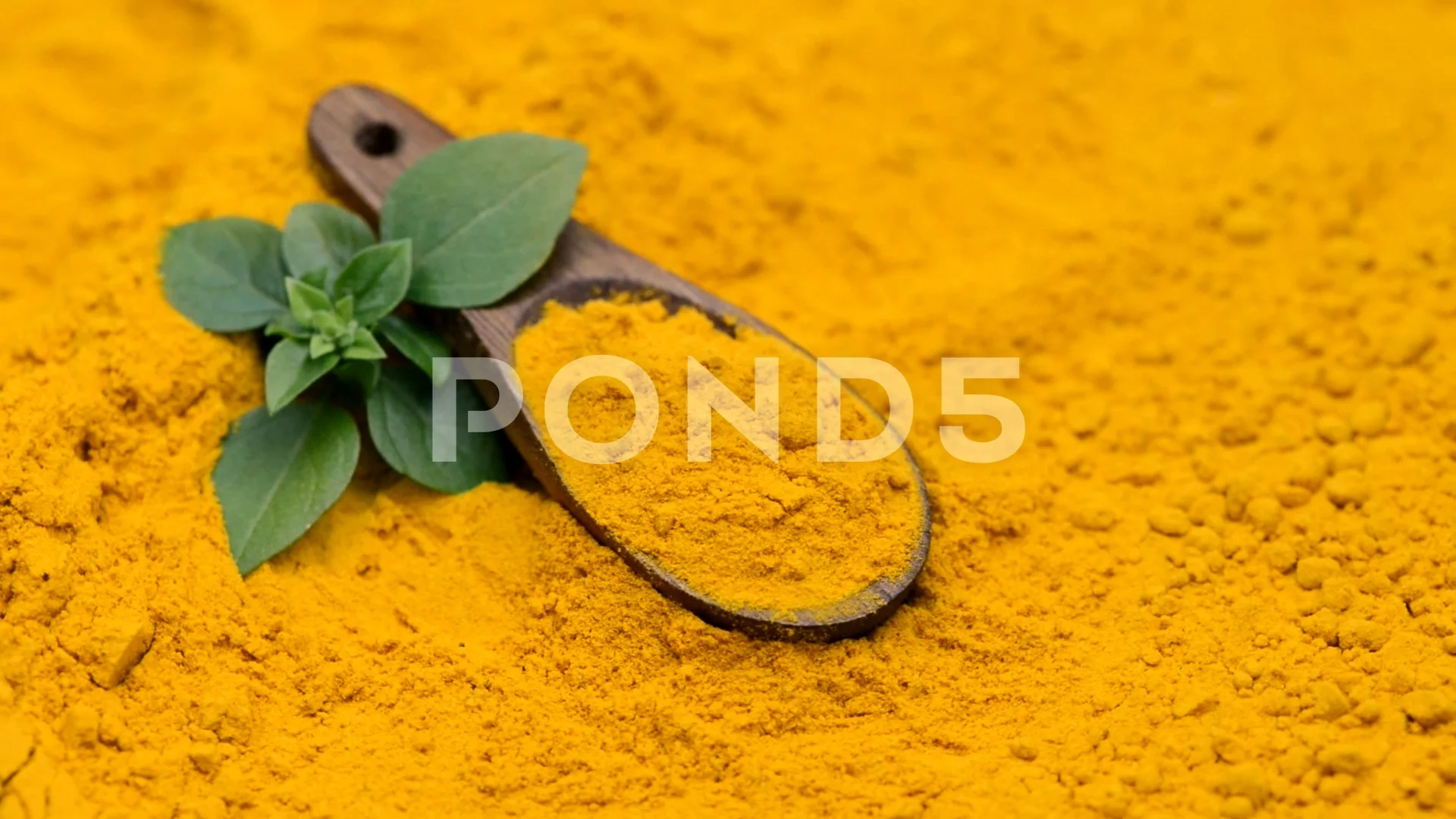 turmeric on a wooden spoon | Stock Video | Pond5