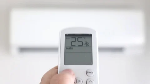 The turn on air conditioner with remote control, close up view. Stock Footage 91323838