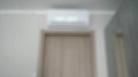 Turn on the air conditioner with the remote control. Stock Footage 197619156