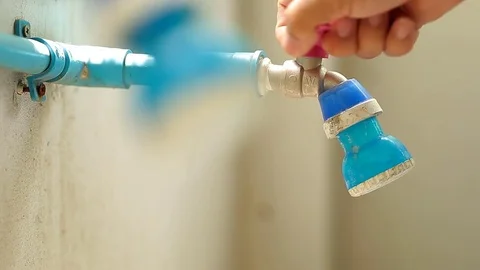 Turn on and off the faucet to help save water to be used throughout. Stock Footage 76506154