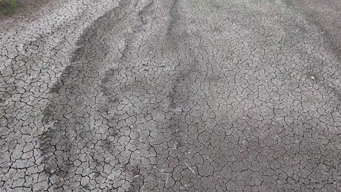 Turn and Forward Camera Shot Over Fractured Dry Soil and Cracked Mud Bed Vídeos de archivo 345099754