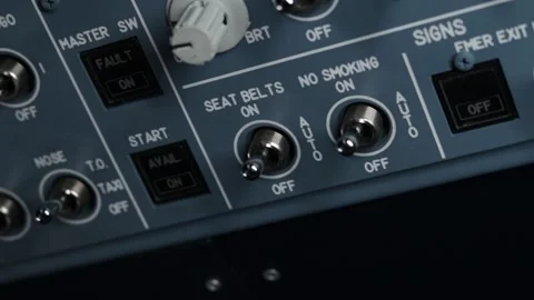 Turn on and off the toggle switch me smoke and fasten your seat belts Stock Footage 224026165