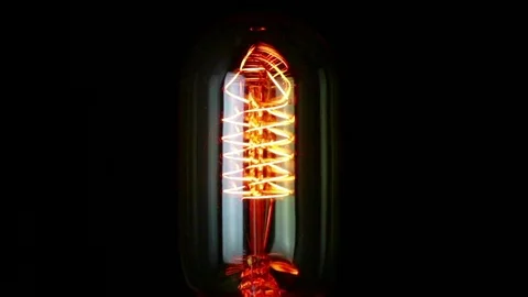 Turn on and turn off in slow motion, one retro vintage light bulb with old Video stock 100344516