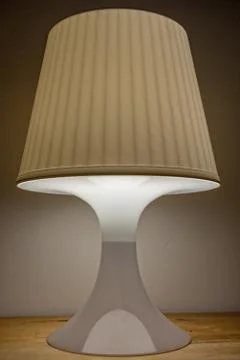 Turn on bedside lamp is on the table Stock Photos
