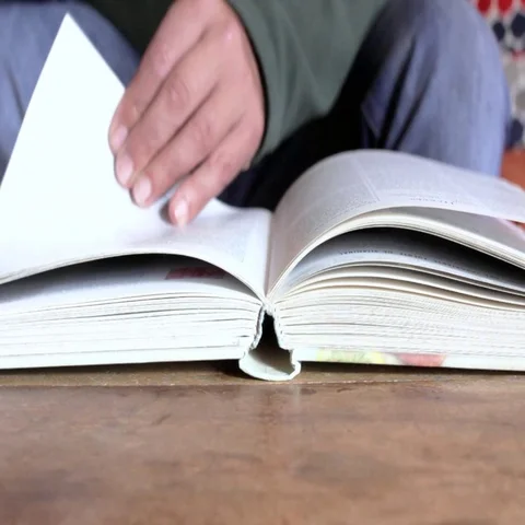Turn a book pages Stock Footage 69338338