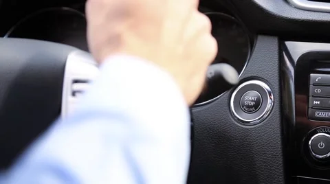 Turn on the car engine with start button Stock Footage 56305578