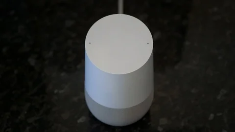 Turn down the volume on a smart speaker Stock Footage 104117372