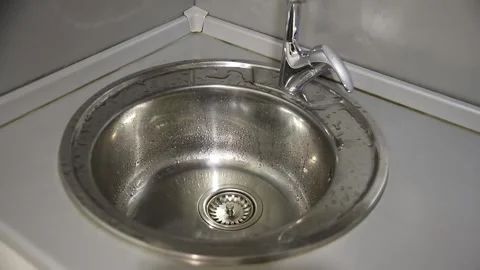 Turn Off The Faucet in kitchen Stock Footage 237284561