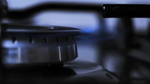 Turn on flame of kitchen stove. use gas to cook, cook on low heat. climate  Stock Footage 212060576