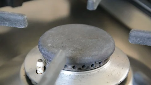 Turn gas ring on and light gas Stock Footage 111095495