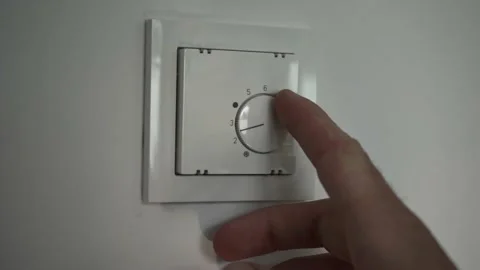 Turn off the heating Stock Footage 201485575
