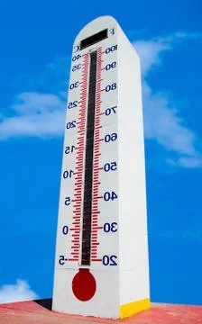 Turn inside out of tower thermometer isolated on blue sky background Stock Photos