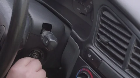 Turn key in the ignition Stock Footage