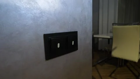 Turn on kitchen light by pressing the switch. light bulb in the fixture lights Stock Footage 340209122