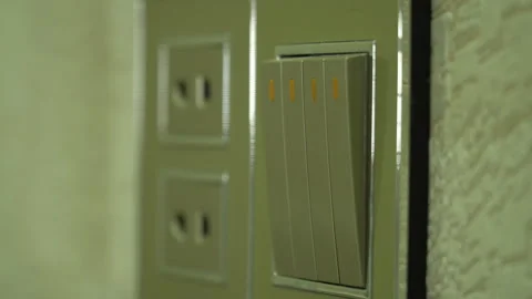 Turn the light on and off using the Switch Stock Footage 255451624