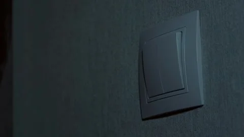 Turn on the light, the guy turns on the light, the girl turns on the light Stock Footage 264325122