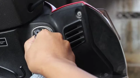 Turn the motorcycle key towards the on indication Stock Footage 312479842