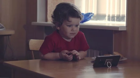 Turn on this one. Adorable shot of two different aged kids sitting next to each Video stock 111190801