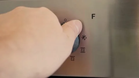 Turn on the oven temperature setting. Stock Footage 147653668