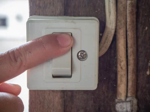 Turn on the power switch close-up. Stock Photos